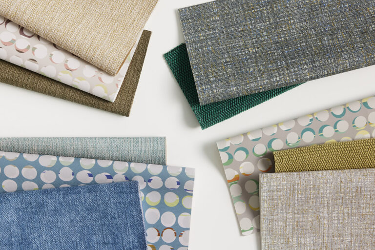 Stacks of various samples in cool-neutrals of blue and green on a white background.