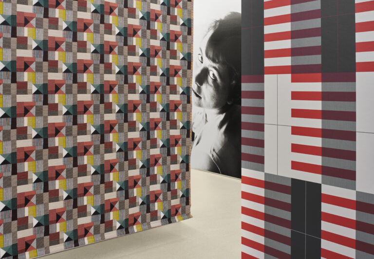 Exhibition display with plinths and hanging textiles