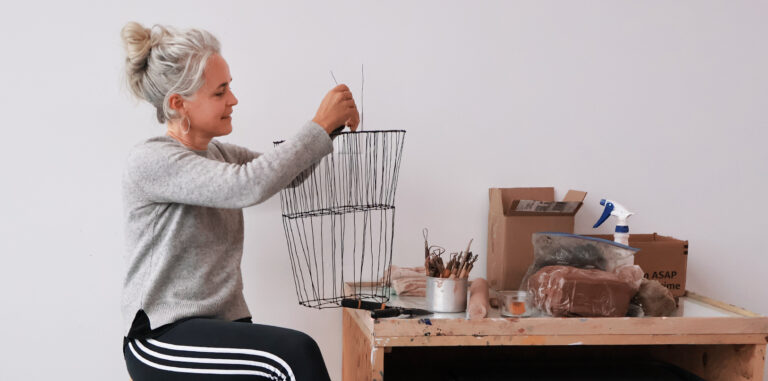 Artist Anna Hepler works on an art piece in her studio.