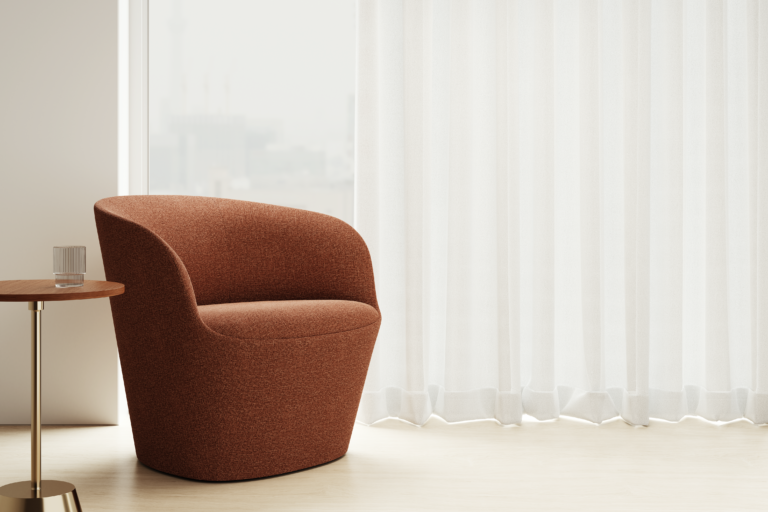 Lounge chair at window with curtain and side table